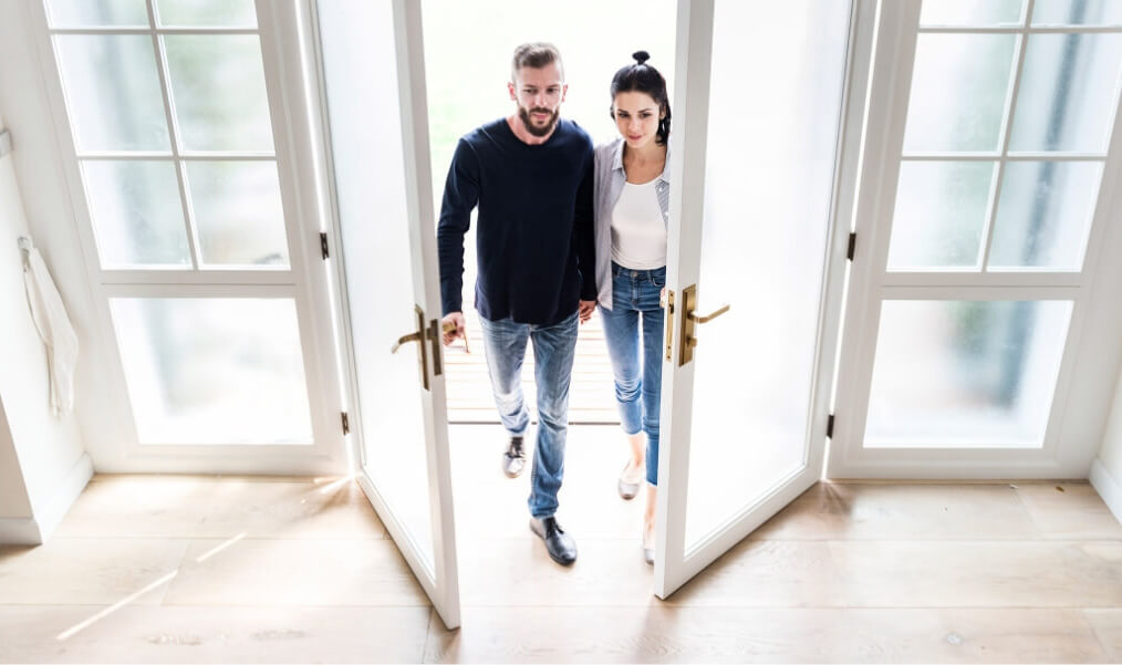 couple entering in new house